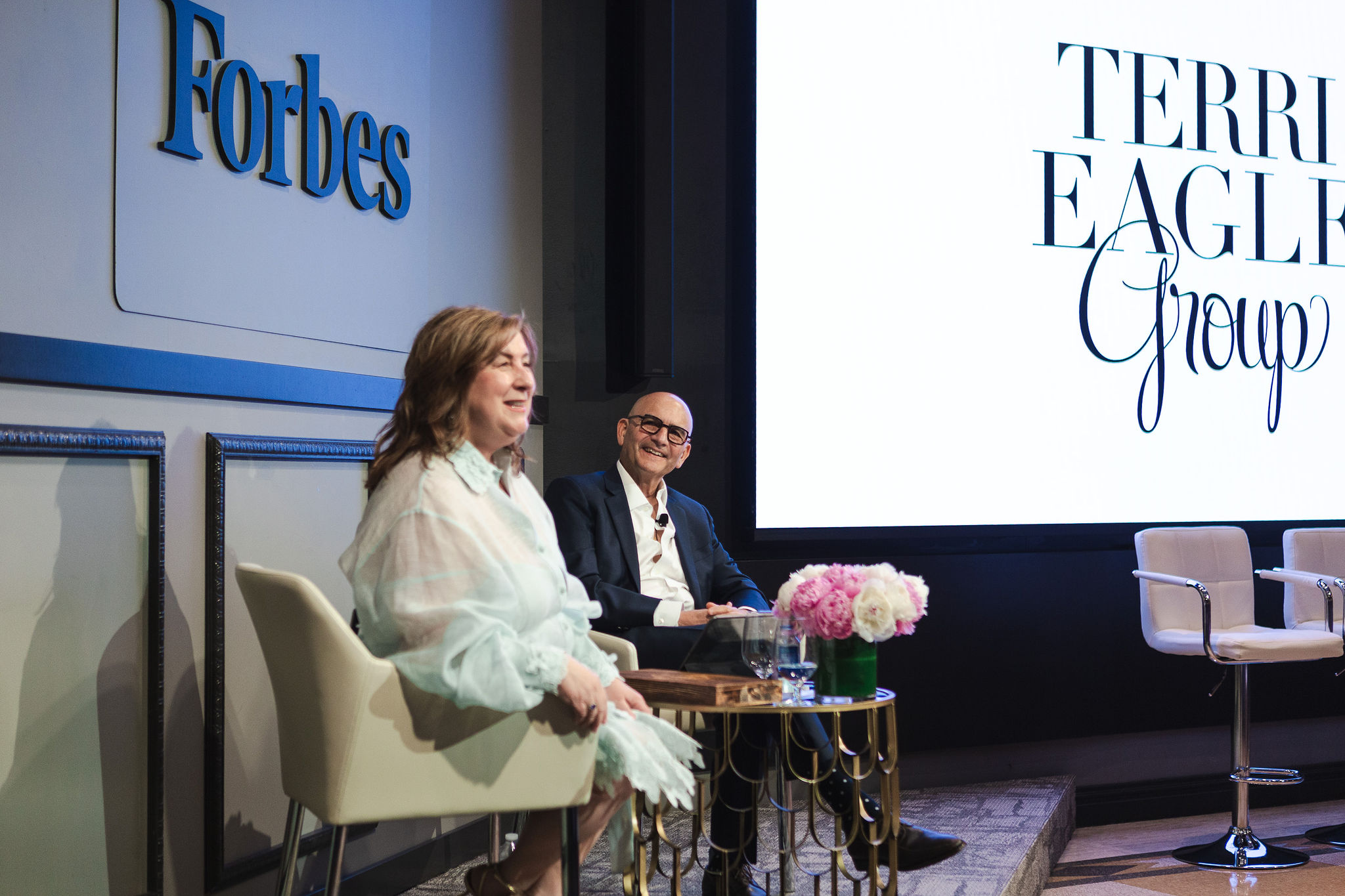 Terri Eagle, Forbes author, executive business advisor, and fractional CEO speaking on leadership, business growth, and enterprise value at a Forbes event.