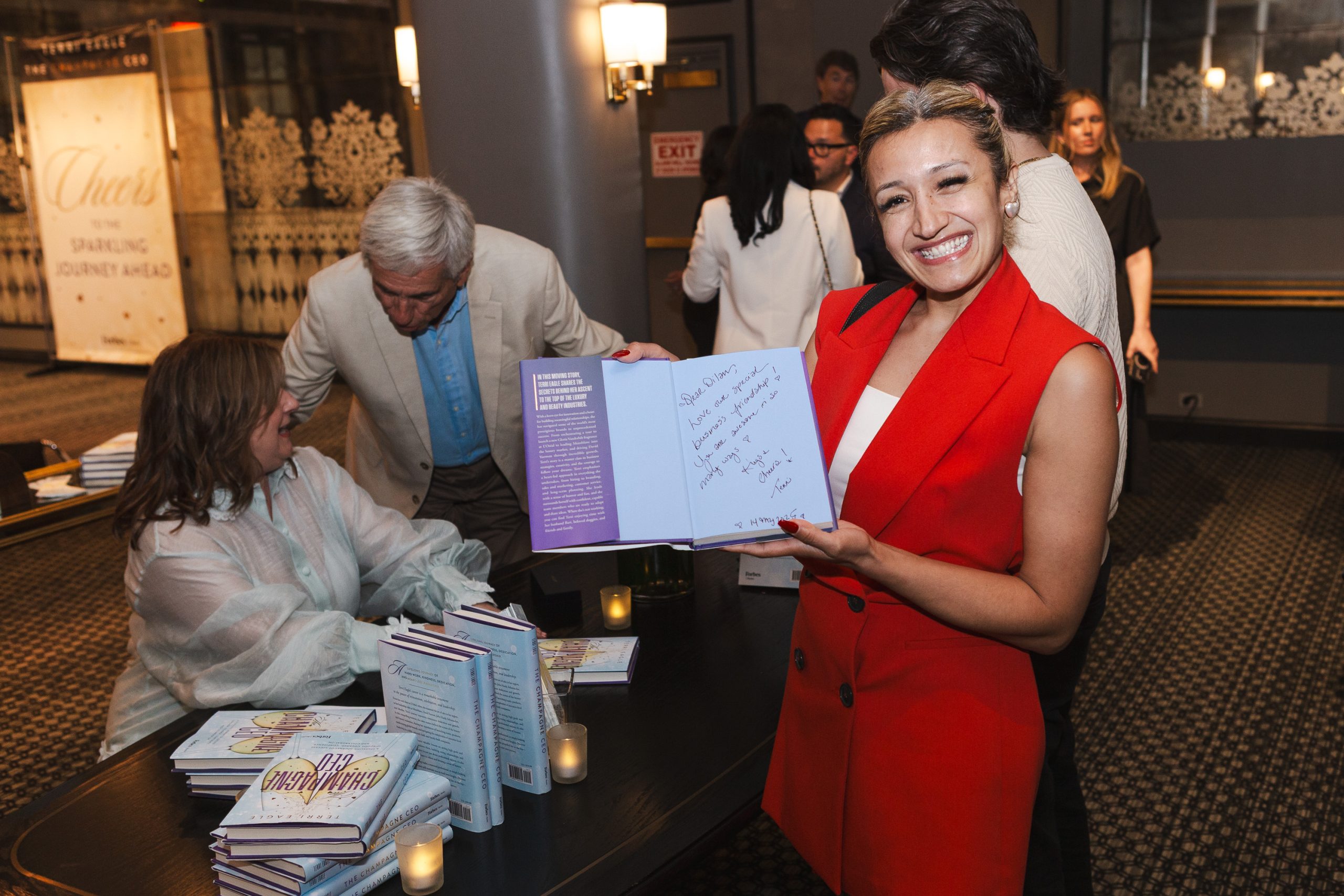 Terri Eagle Book Signing | The Champagne CEO Forbes Books Event Terri Eagle signing copies of The Champagne CEO at a Forbes Books event while greeting readers and celebrating her Amazon bestselling leadership book.