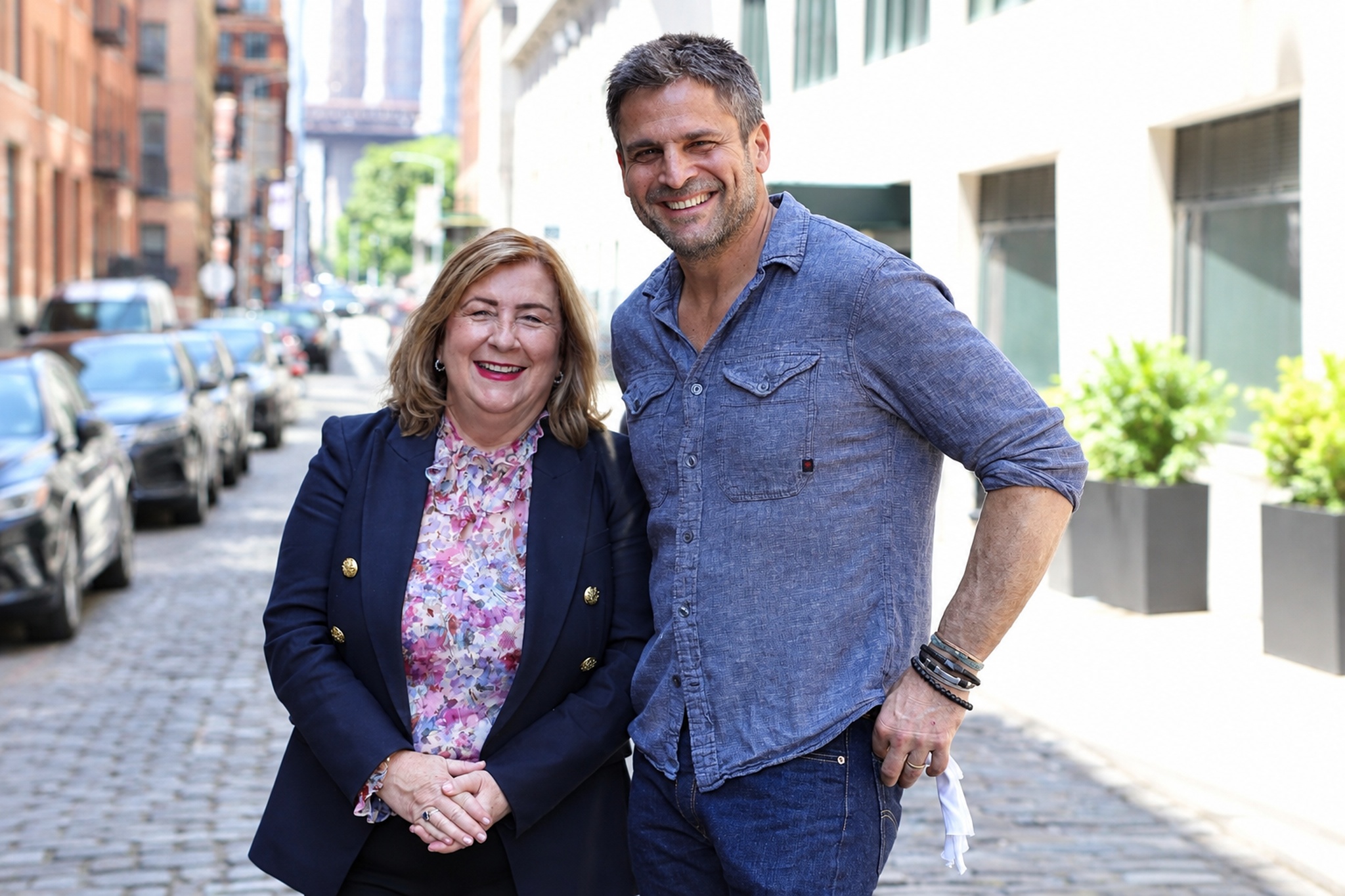 Terri Eagle smiling with Mark Jupiter on a city street